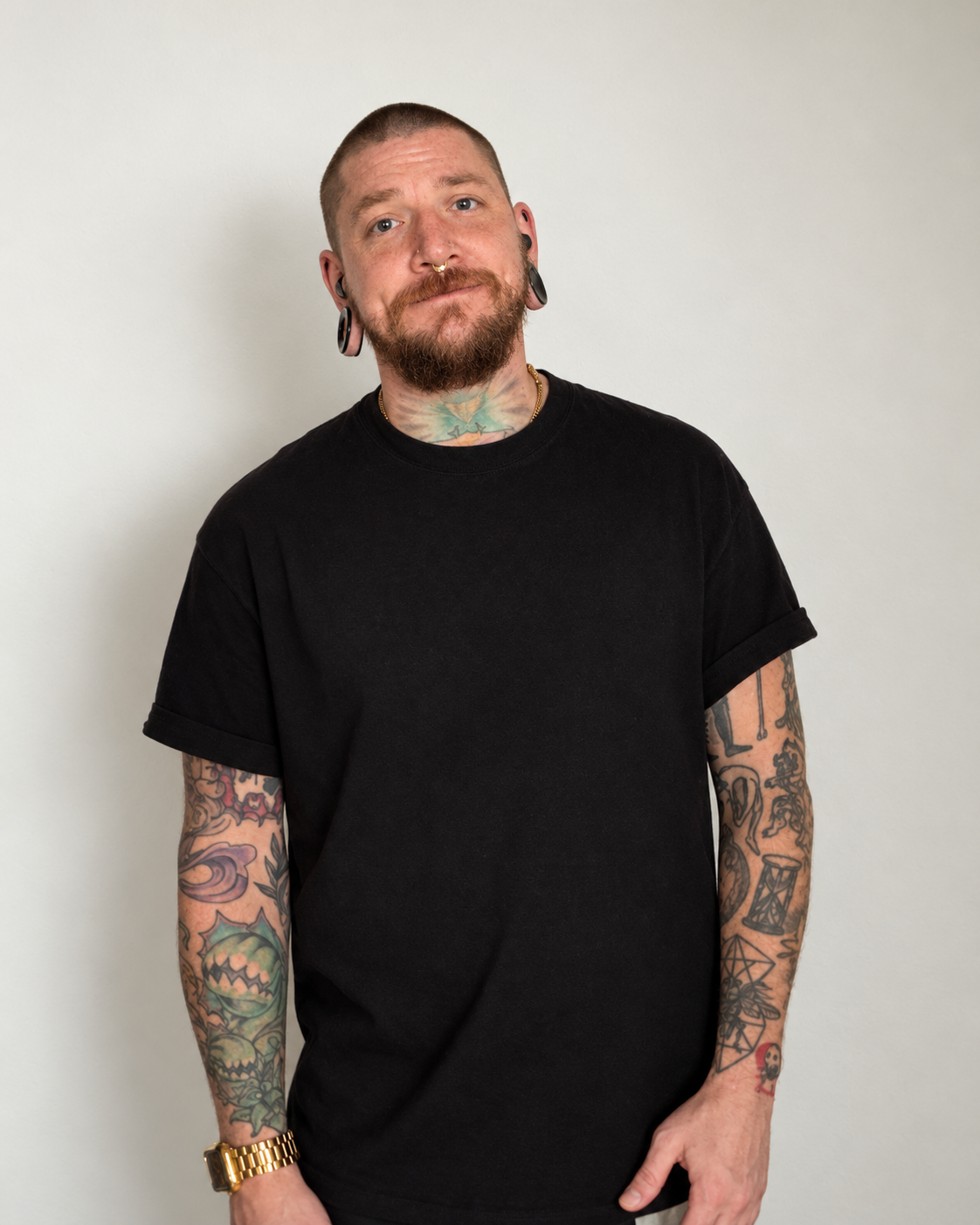 Damon Medwin wearing a black T-shirt against a light background